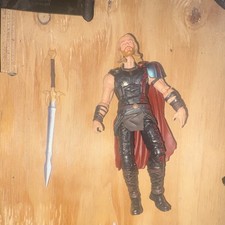 Marvel legends Thor action figure with sword accessory, black outfit, red cape
