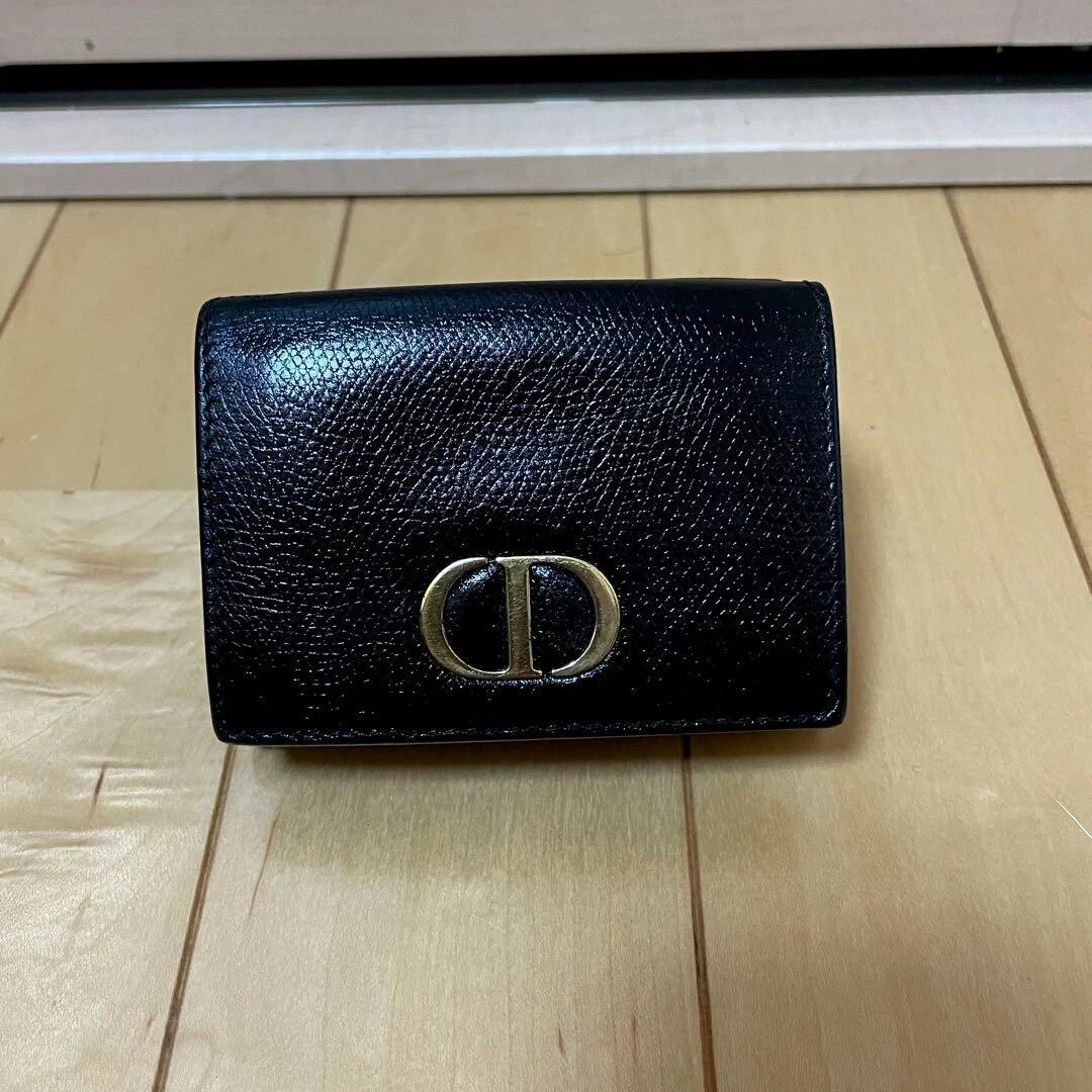 Portefeuille Christian Dior pliable en cuir revue