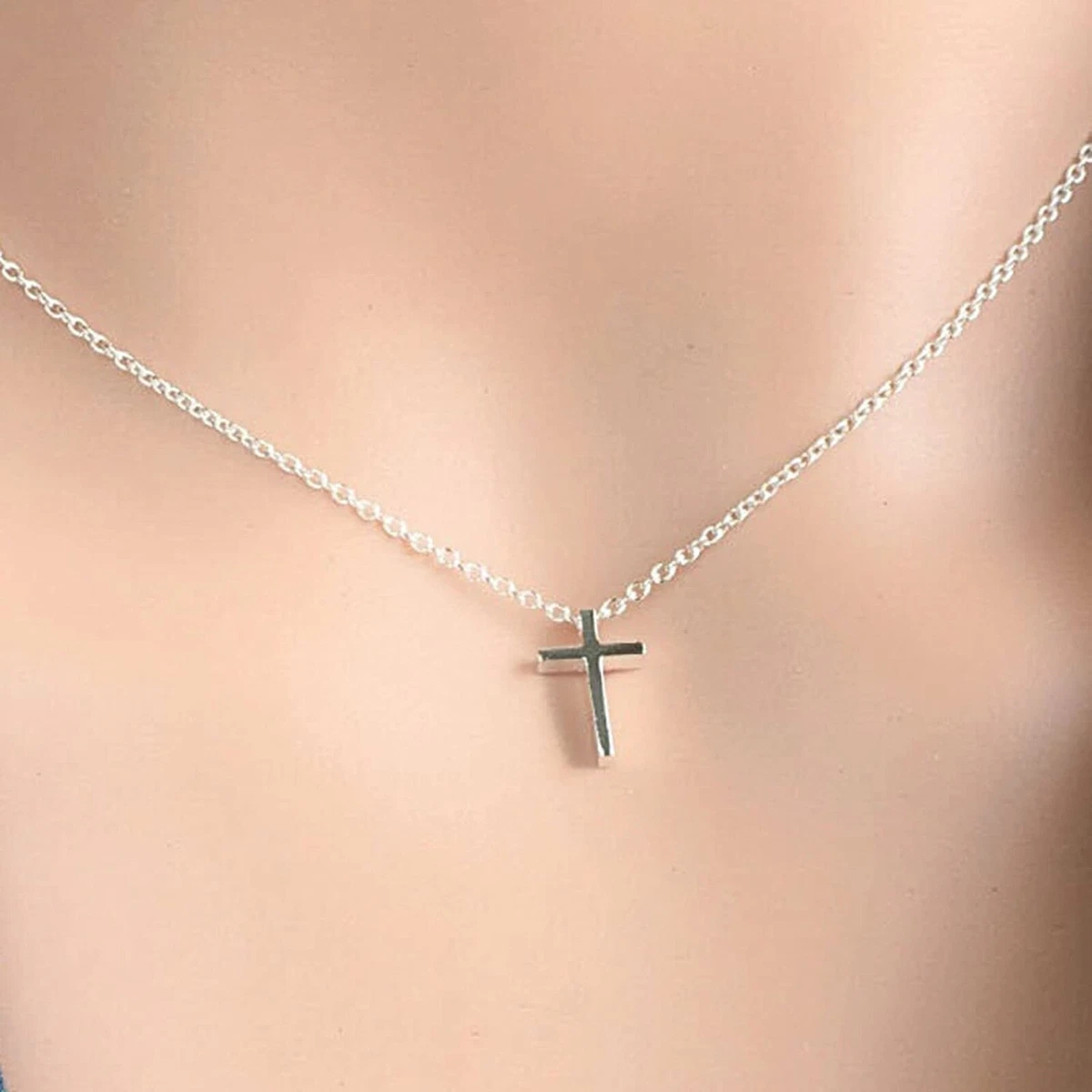 Tiny silver cross sale necklace