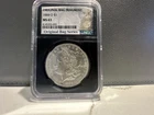 SEALED 1884-O MORGAN “BAG FRAGMENT” SILVER DOLLAR - NGC MS-63