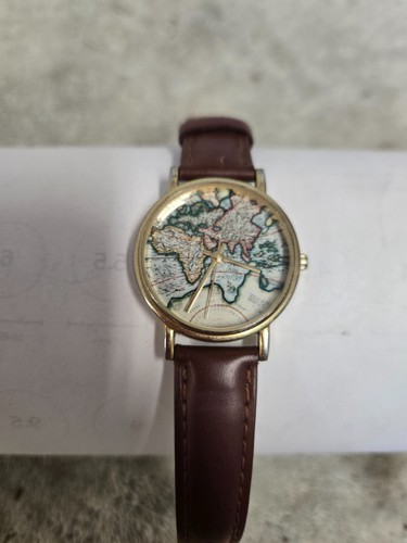 unbranded wrist watch, map of world on dial, leather ban, fresh battery
