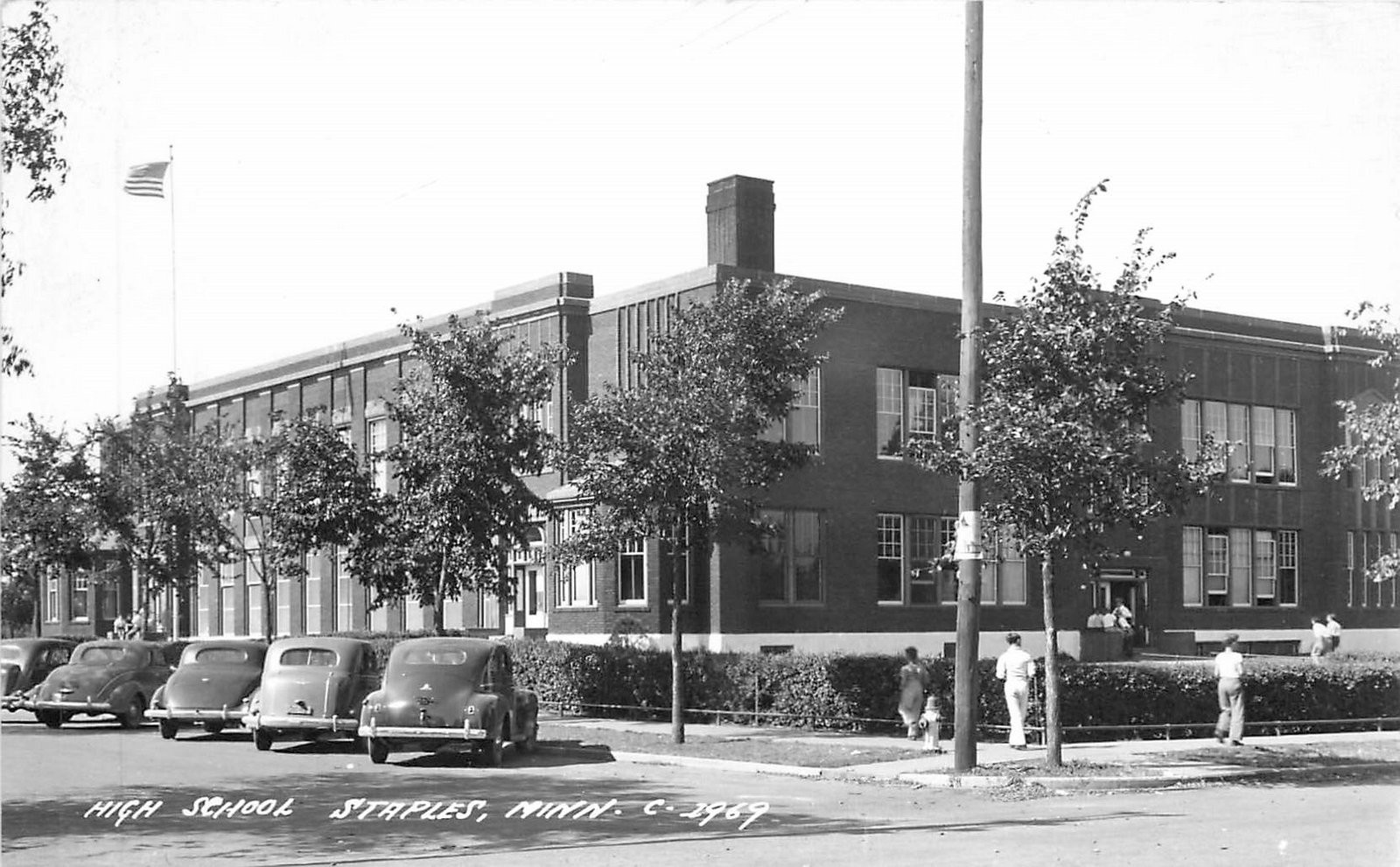 1940s Staples Minnesota High School occupation autos RPPC Postcard 25-9549