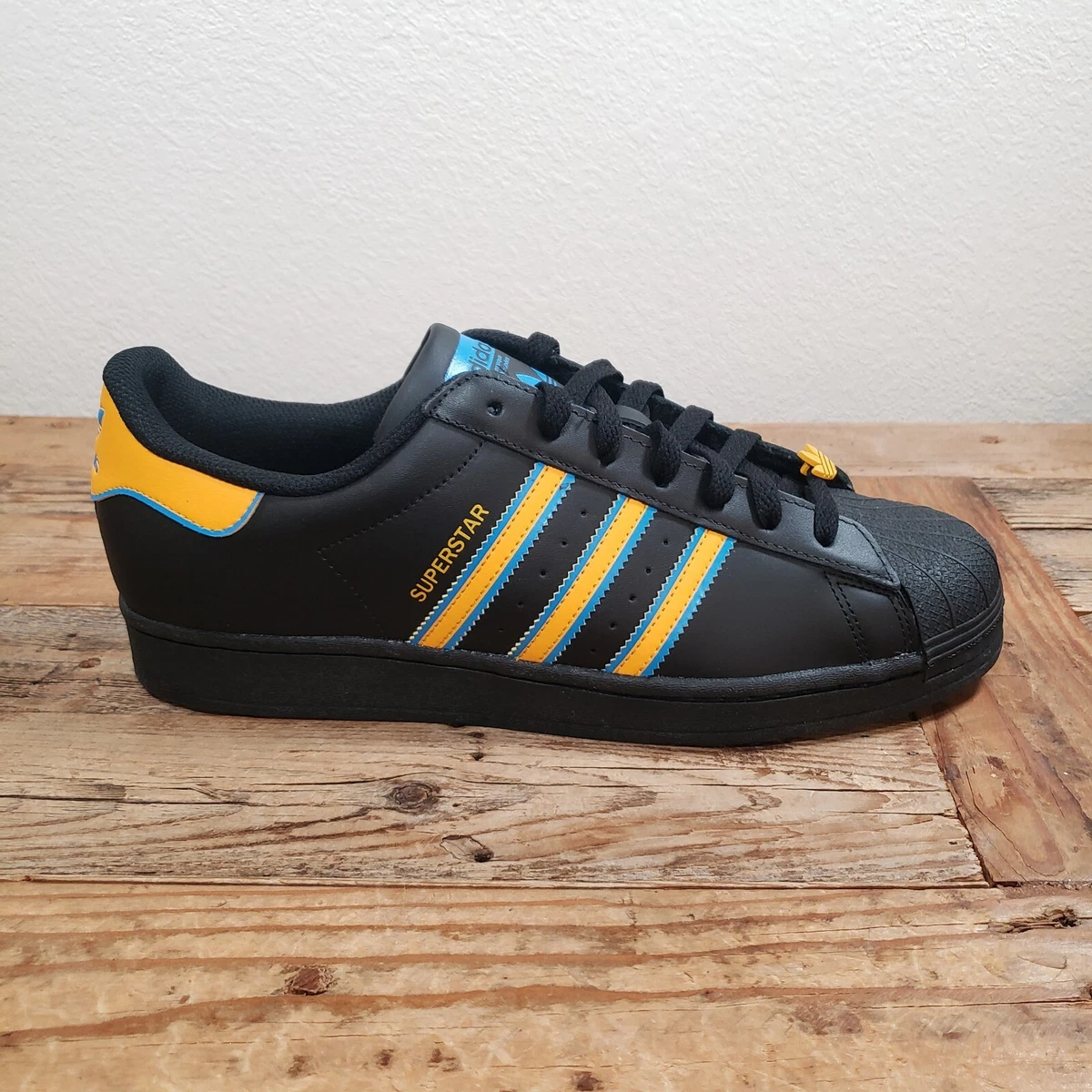 adidas superstar black and gold