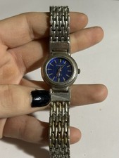 Women's Geneva dress watch. Small blue face with gold vertical line design