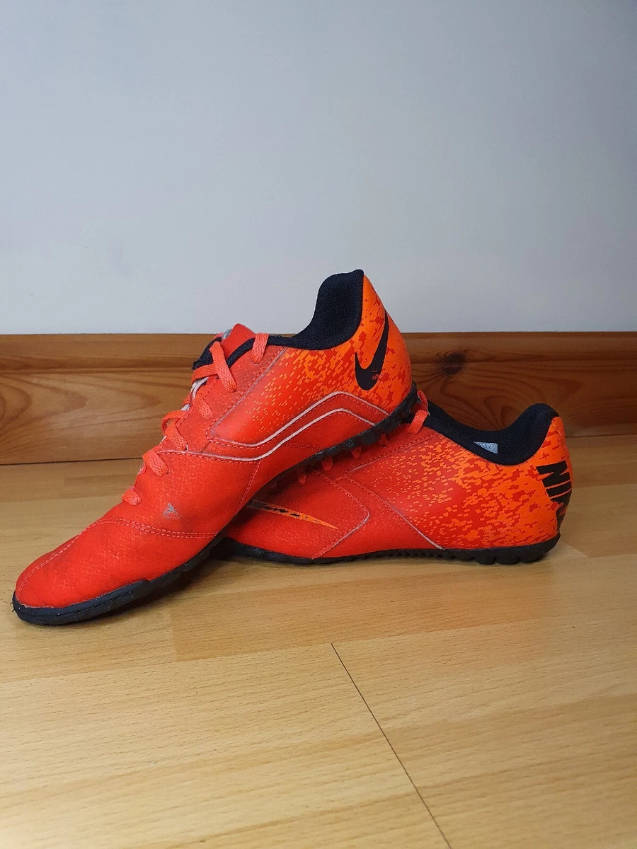 Red astro store turf football boots