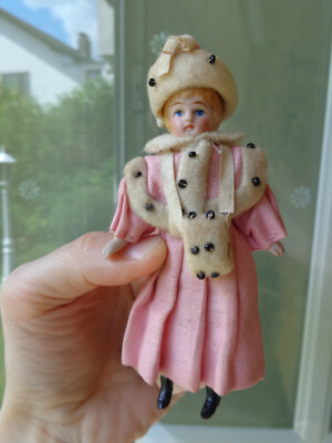 Antique doll with nice clothes