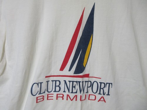 White short-sleeve shirt with black and red Sz L Vtg Bermuda Club Newport logo and navy text reading “Club Newport Bermuda.”