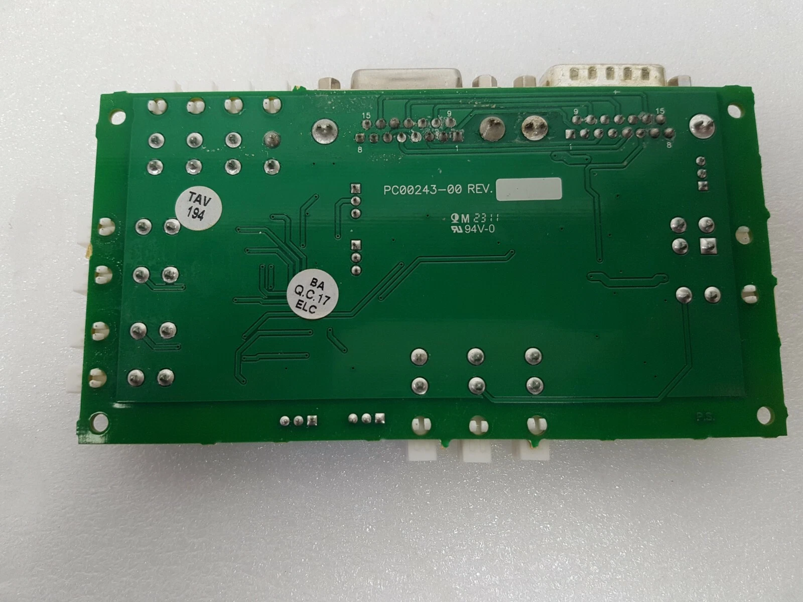 Back of the AY00243-00D board: PCB PC00243-00, 94V-0, TAV 194 and QC stickers