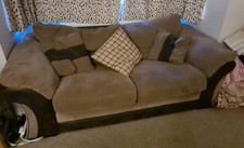 2-Seater Comfortable Sofa Bed, Small Double, brown with wood & metal bed frame.