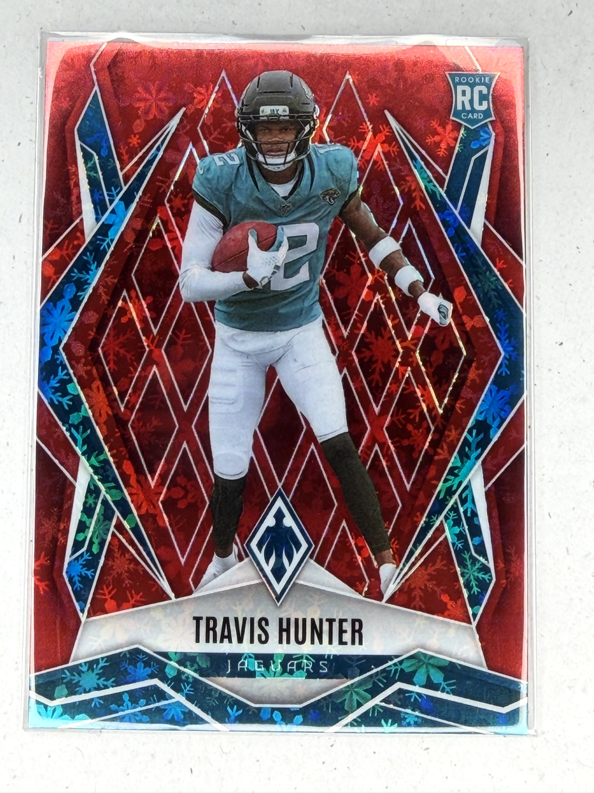 2025 Panini Phoenix - Rookies Travis Hunter #157 Red Winter /399 (RC)