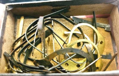 Feeble Thin Tube Tests box labeled Clock Clicks with parts
