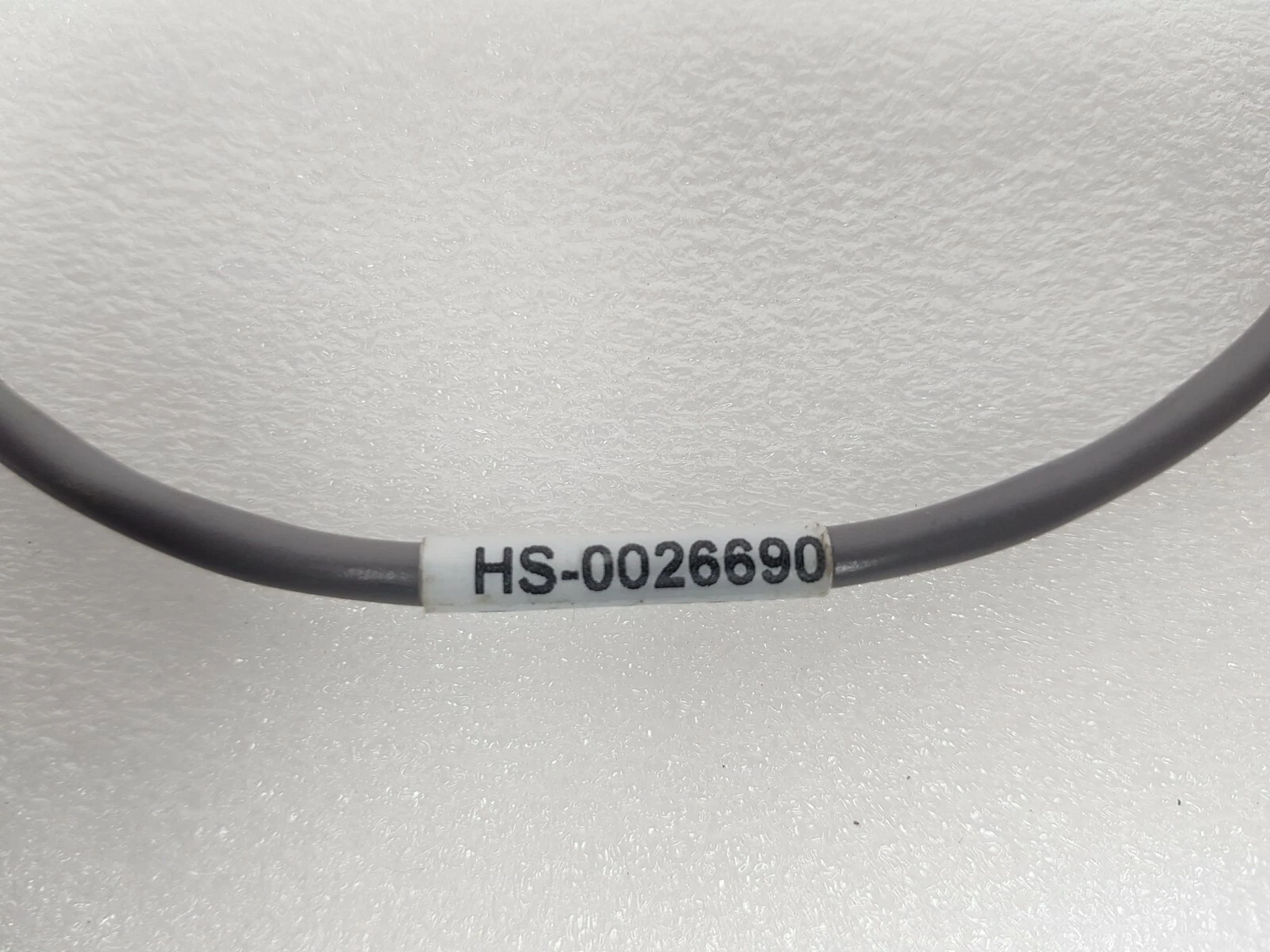 Marker sleeve HS-0026690 on the gray Lumenis cable