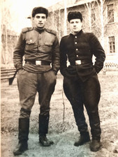 Vintage photo of two soldiers of the Soviet Army in cold weather.