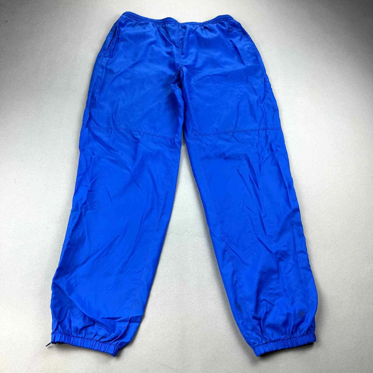 Side swoosh logo track pants sale