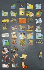 Lot 38 pin's  divers Hippisme Jeux Olympiques BD Citroën Virtuel Publicité