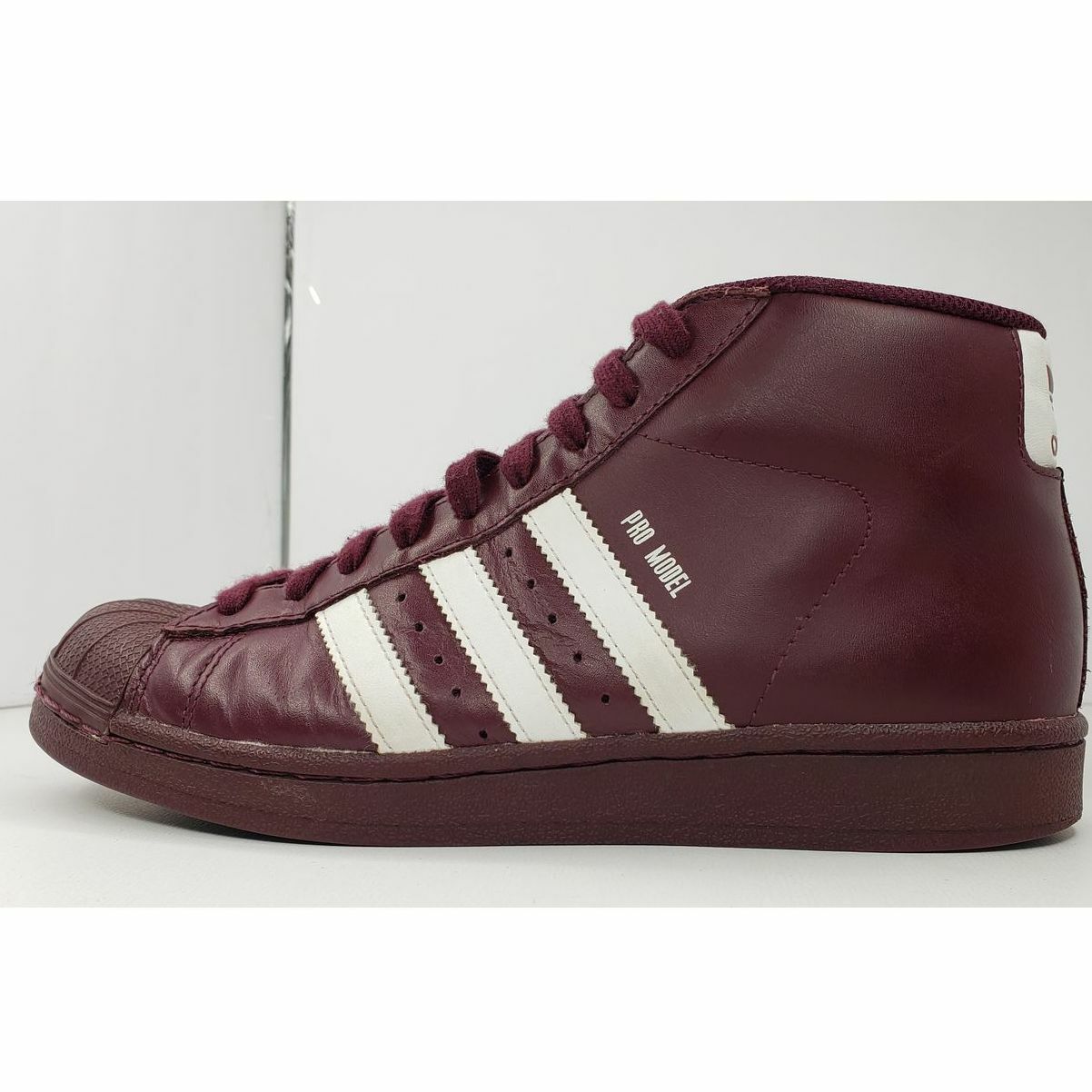 burgundy high top shell toe adidas