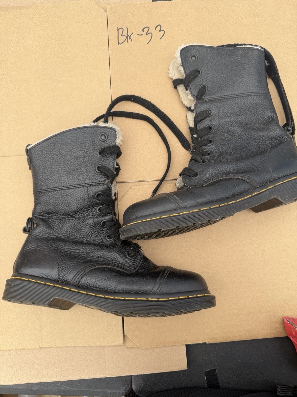 Dr Martens leather faux fur black boots women. Size 10. Slightly used