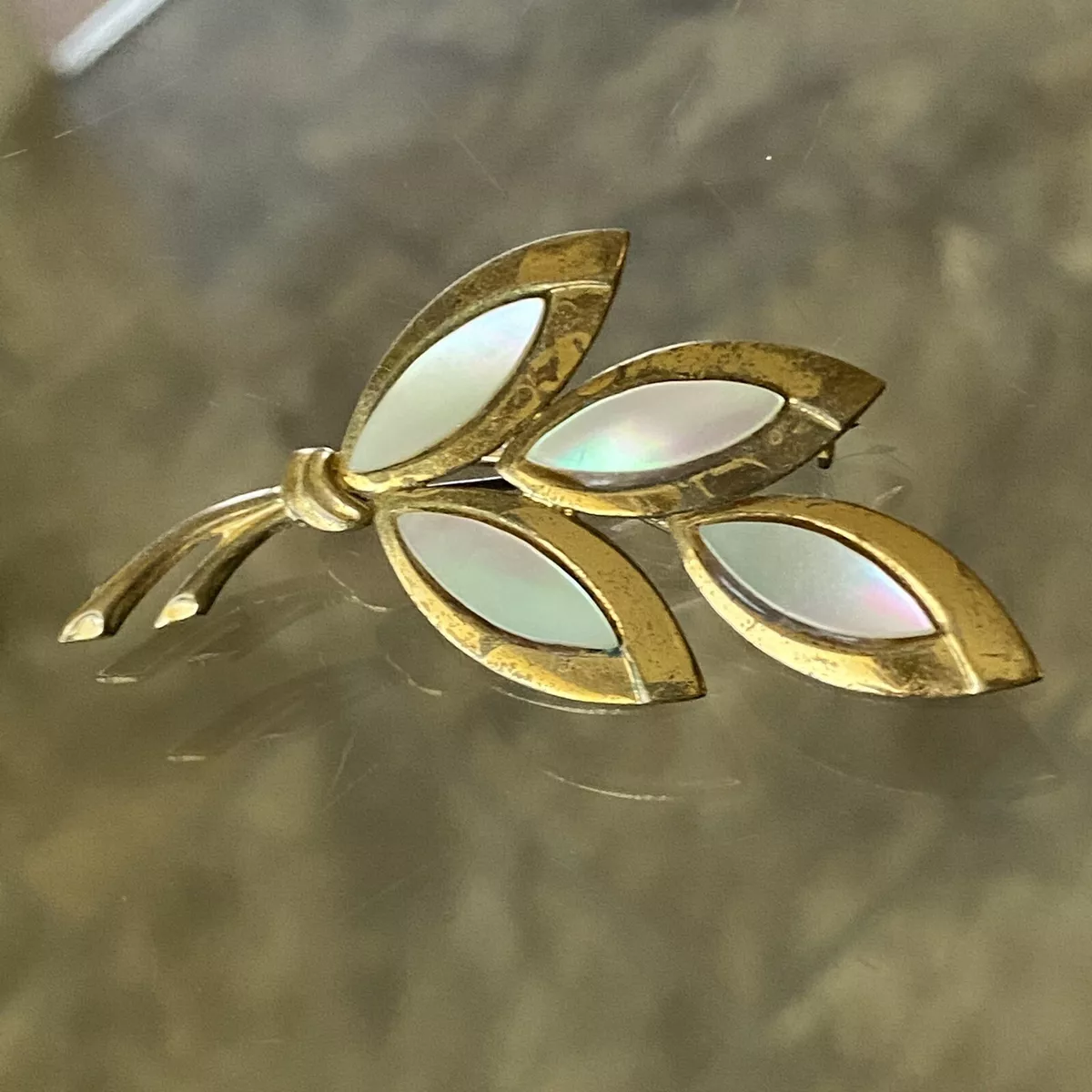 Brass brooch on sale