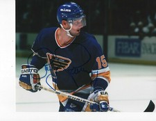ST. LOUIS BLUES CRAIG JANNEY SIGNED BLUE JERSEY 8X10 