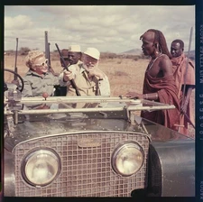 1953 Ernest,Mary Hemingway in a jeep talking African man,during a safari