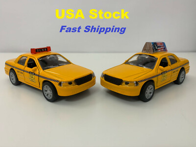 yellow taxi toy car