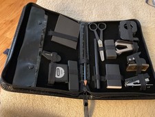 Stationary Organizer in Black Portable Case With Office Supplies Inside.