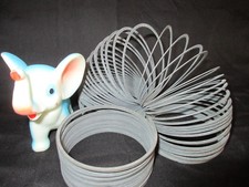 Vintage 2 Slinkies and a Toy Squeaky Elephant