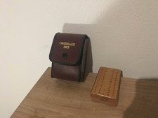 Brown leather case with wooden cribbage set