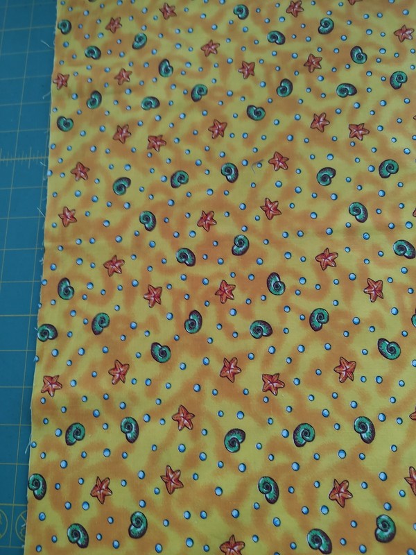 21" WOF Quilt shop fabric. No name salvage.Vintage shells and starfish on yellow