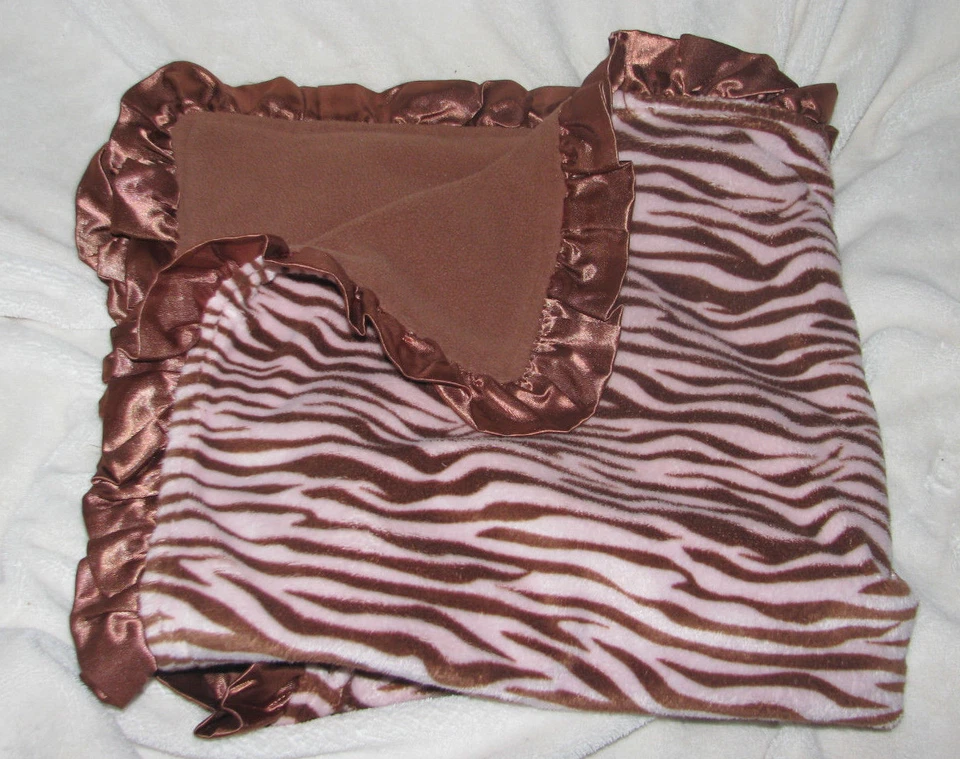 MANTA BEBÉ NIÑA VITAMINAS ROSA MARRÓN POLAR MINKY CEBRA ANIMAL VOLANTES SATINADO Foto 3 de 3