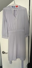 Tory Burch size medium periwinkle dress. Belt tie and side zipper closure. Gold
