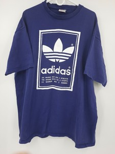 the brand with the three stripes shirt