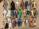 27 Vintage Star Wars action figures, most with blasters. 2 additional blasters