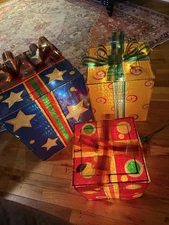 Trim A home set of three prismatic square presents,  Sizes 10” , 12” & 15”