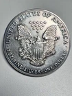 U.S. Mint 1987 $1 American Eagle 1 oz .999 Fine Silver Coin - lightly toned