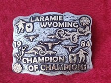 RODEO BULL RIDER FIGHTER CHAMPION TROPHY BELT BUCKLE  LARAMIE WYOMIN  RARE  1984  03