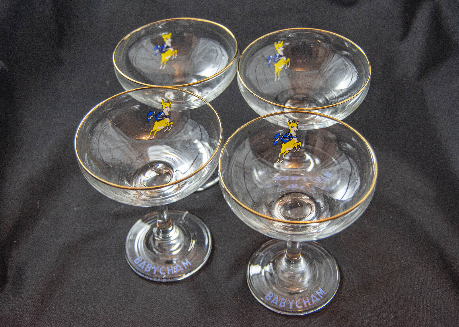 Set of 4 of vintage Babycham glasses from1970's with yellow fawn. eBay