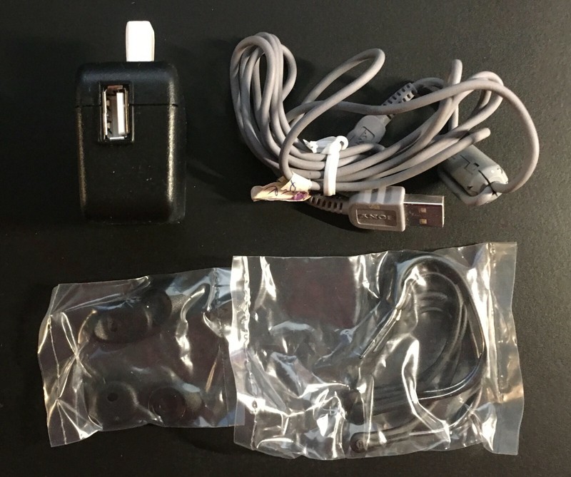Jawbone Bluetooth wall adapter with 4 earbugs and earloops