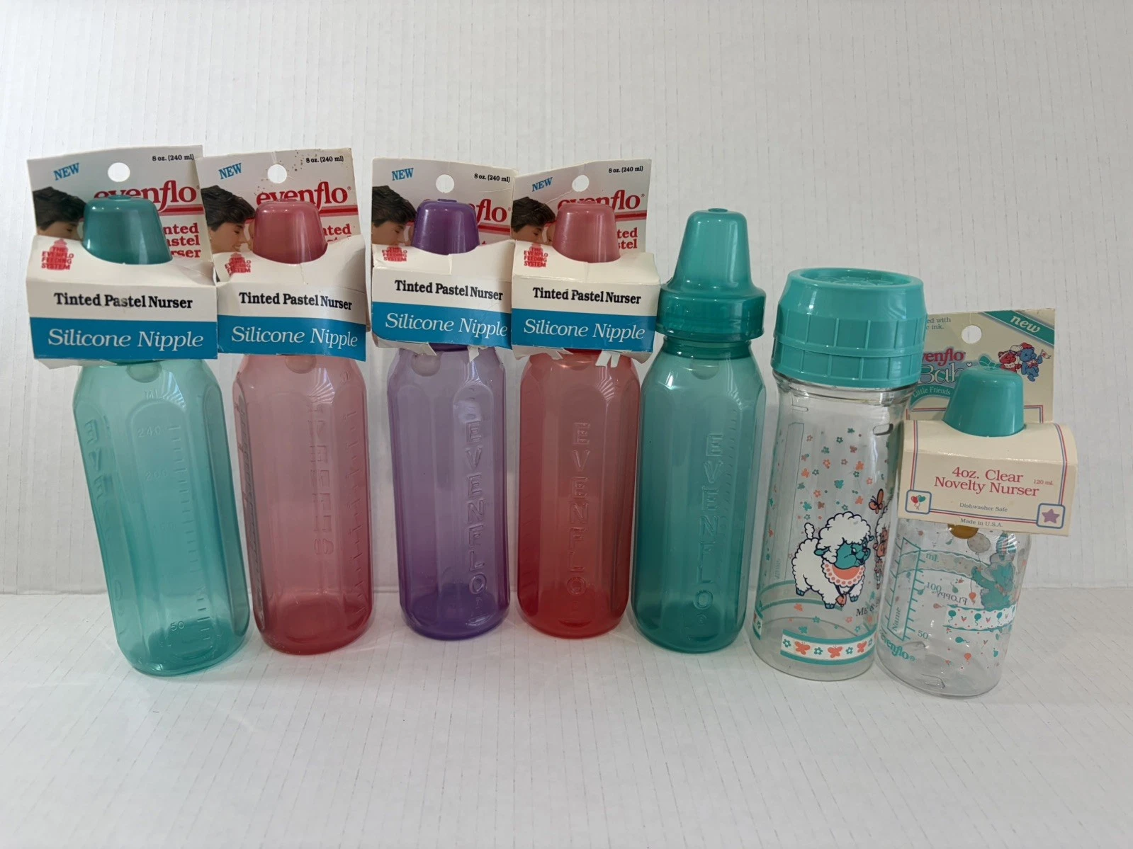Vintage 1993-94 Evenflo Tinted Pastel Plastic Baby Bottles 4-8oz Silicone Bundle