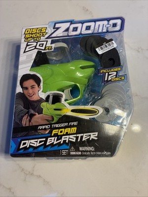 Brand New  Zoomo Rapio Trigger Fire Foam Disc Blaster Includes 12 Discs