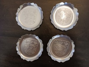 4 vintage aluminum drink coasters 3 1/2" dia. Fleur de Lis, Lion, Maple Leaves