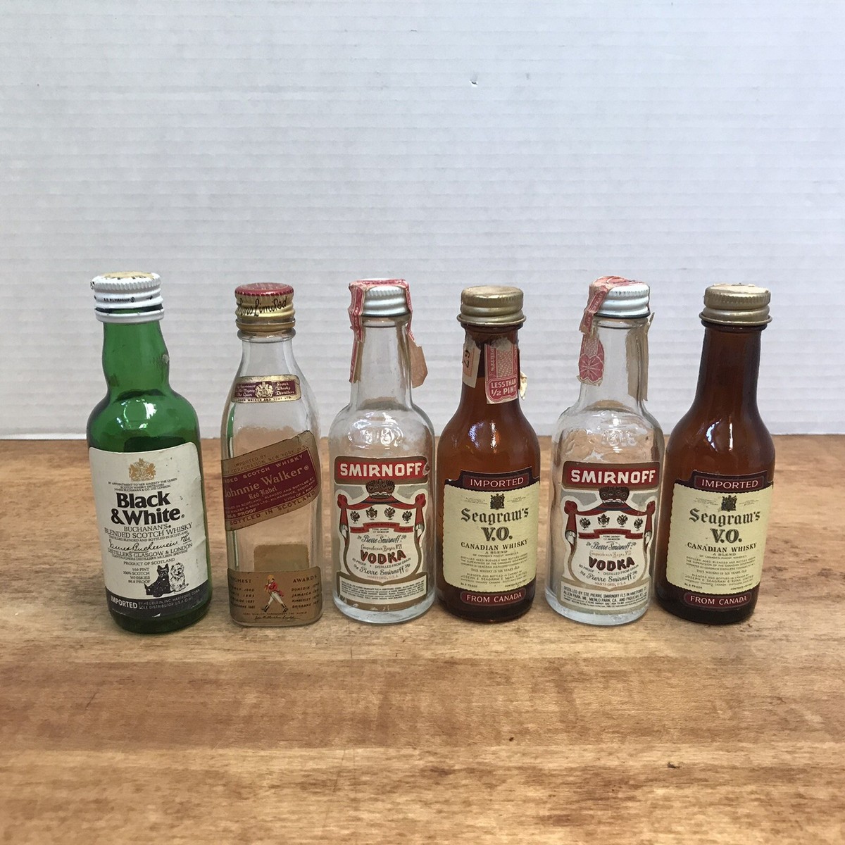 cigarettes and tiny liquor bottles 6 Vintage Mini Airplane Shooter Liquor Bottle Smirnoff Seagram Johnnie  Walker