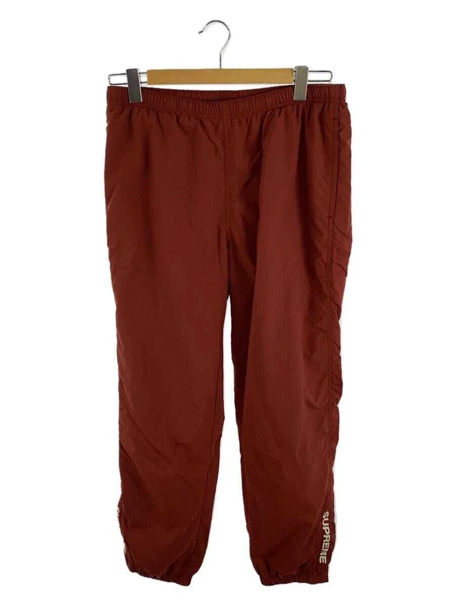 Pantalon Supreme WARM UP nylon rouge S Occasion