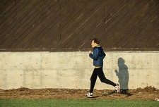 Kenny Moore warms up before competing in the Legends Mile event 19- Old Photo