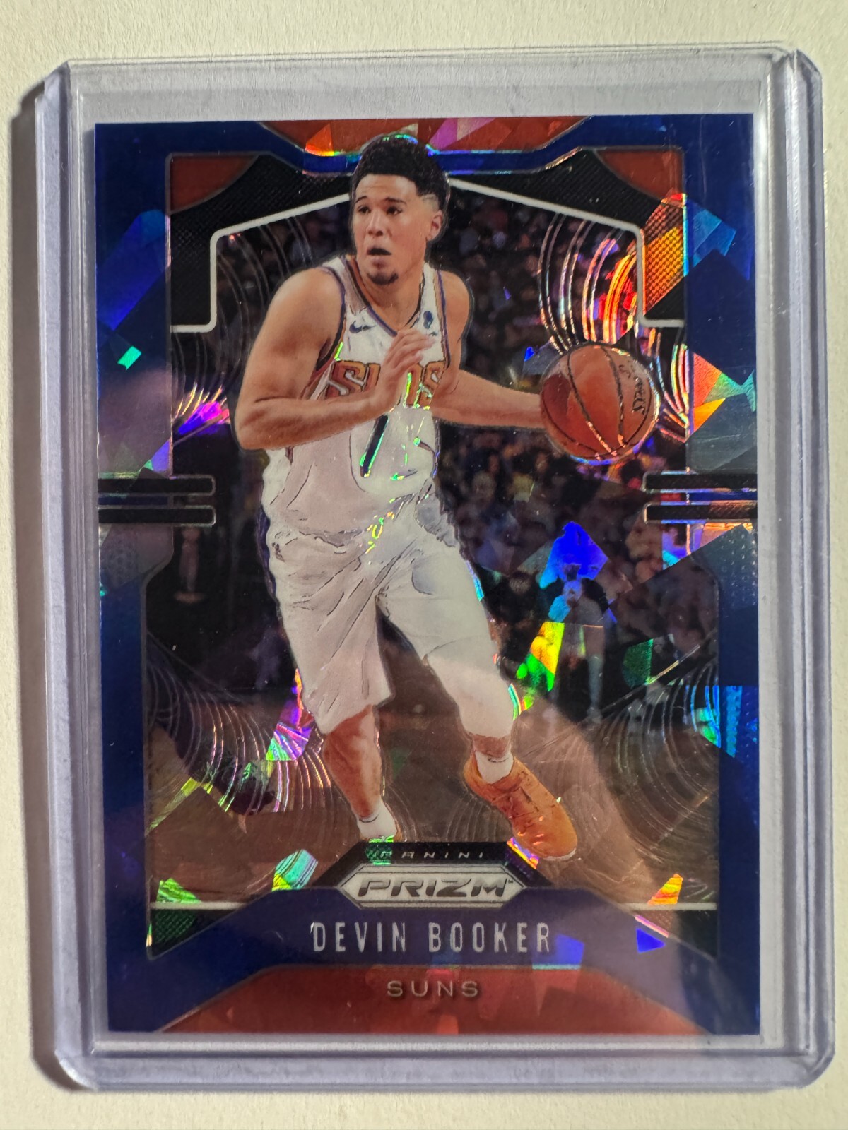 K274,815 - 2019-20 Panini Prizm Prizms Blue Ice #67 Devin Booker #/99