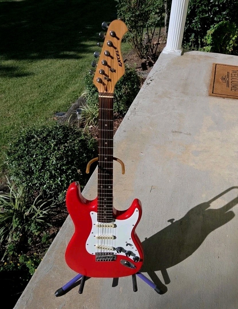 Excel Stratocaster style electric guitar  1980s musical instrument New Strings