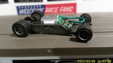 AFX RACING H.O. SCALE MEGA G 1.7 NARROW CHASSIS GRAY 5 SPOKE RIMS GREEN CAM