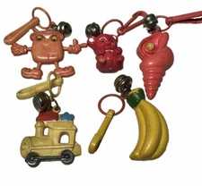 Vintage 1980s Lot Of 5 Bell Charms Plastic Clip On Train Banana Seashell Bear