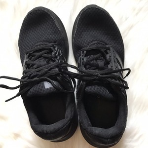 solid black running shoes