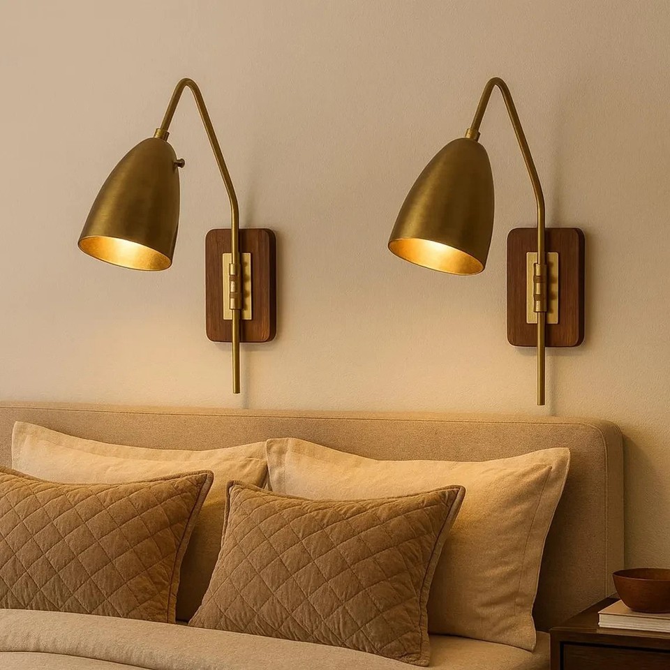 Adjustable brass cone sconces with that perfect mid-century silhouette — the kind of lighting that makes a room look like a set from Mad Men.